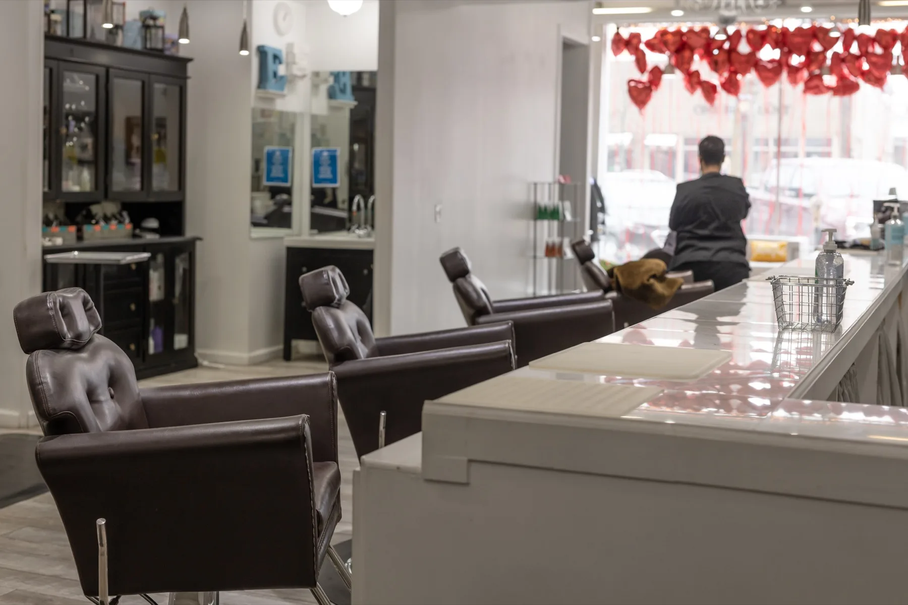 A guest mid-blowout at our Pittsburgh blow dry bar, hair smooth and glossy